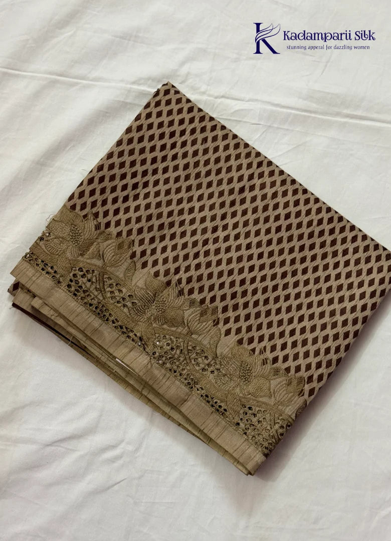 Kadamparii Silk beige tussar silk saree with woven body pattern and detailed cutwork border, displayed on a white background.