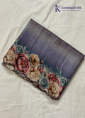Kadamparii Silk grey tussar saree with digital body and multicolour floral border, displayed on a white background.
