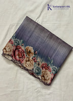 Kadamparii Silk grey tussar saree with digital body and multicolour floral border, displayed on a white background.