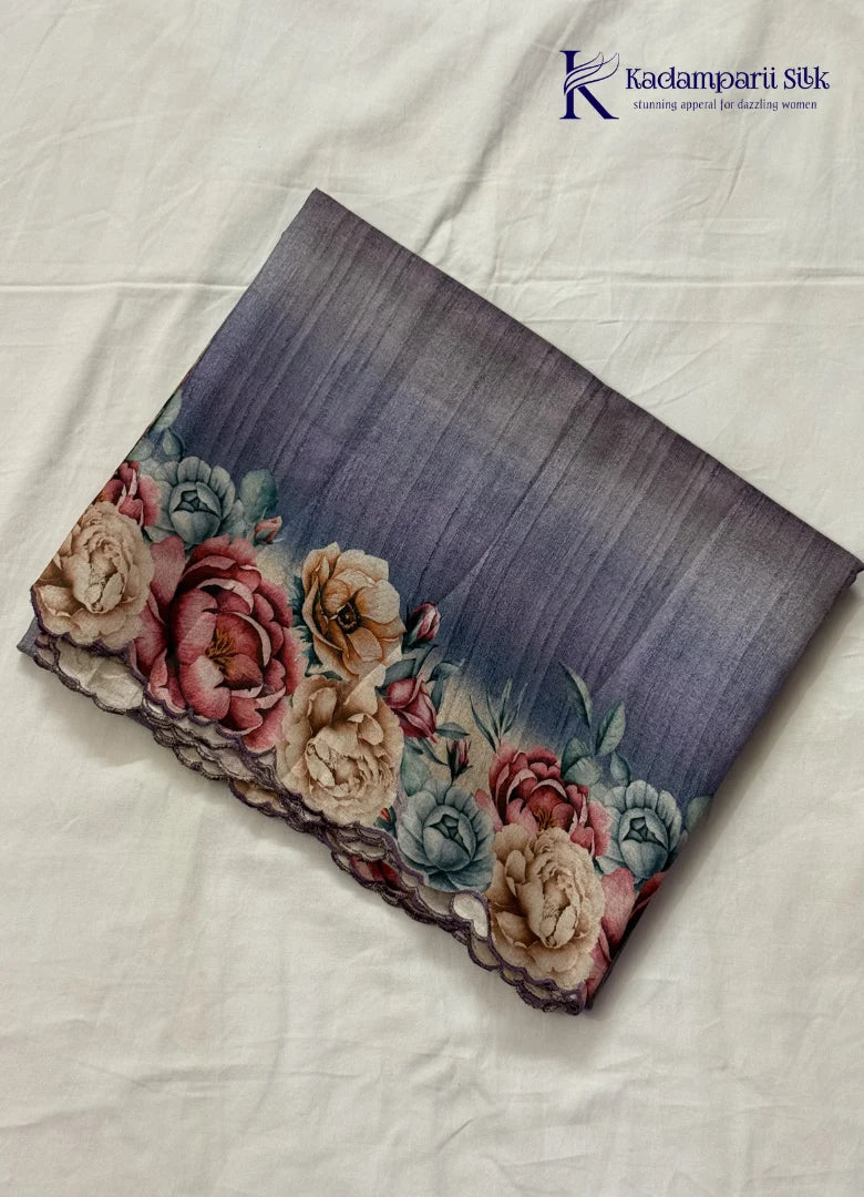 Kadamparii Silk grey tussar saree with digital body and multicolour floral border, displayed on a white background.
