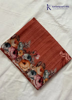 Kadamparii Silk rust orange tussar saree with digital body and multicolour floral border, displayed on a white background.