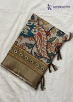 Kadamparii Silk beige soft tussar silk saree with Kalamkari style floral print and traditional border, displayed on a white background.
