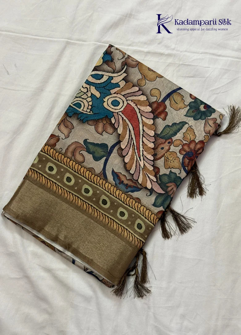 Kadamparii Silk beige soft tussar silk saree with Kalamkari style floral print and traditional border, displayed on a white background.