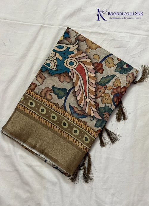 Kadamparii Silk beige soft tussar silk saree with Kalamkari style floral print and traditional border, displayed on a white background.