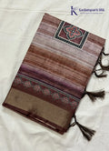 Kadamparii Silk brown soft tussar silk saree with digital print body and traditional motif border, displayed on a white background.