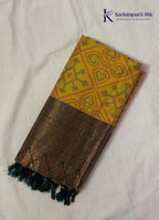 Kadamparii Silk mustard semi soft silk saree with Pochampally design and contrast woven border, displayed on a white background.