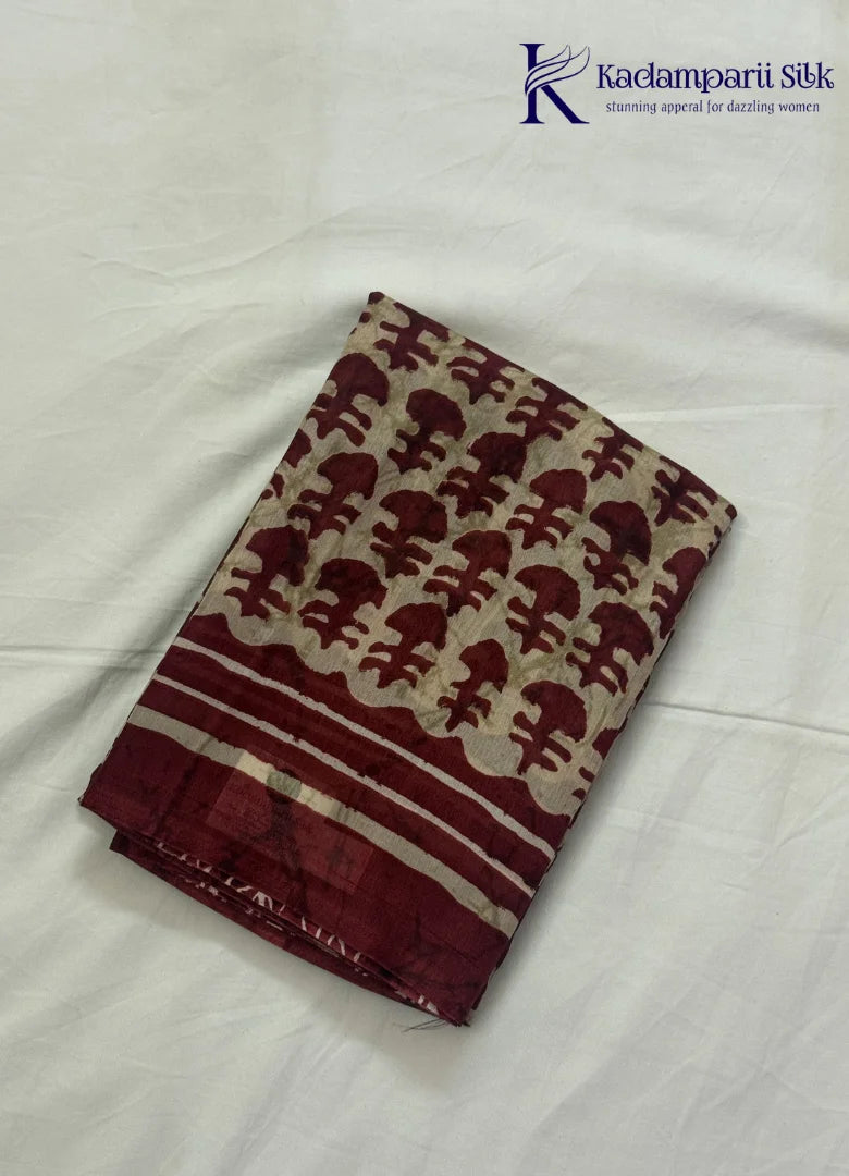 Kadamparii Silk beige semi tussar silk saree with maroon printed pattern and matching striped border, displayed on a white background.