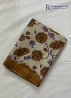 Kadamparii Silk cream semi tussar silk saree with mustard purple floral print and mustard border, displayed on a white background.