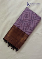 Kadamparii Silk lavender semi silk saree with Pochampally design and rich woven border, displayed on a white background.