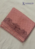Kadamparii Silk dusty pink raw silk saree with embroidery work, subtle body motifs, and decorative border, displayed on a white background.
