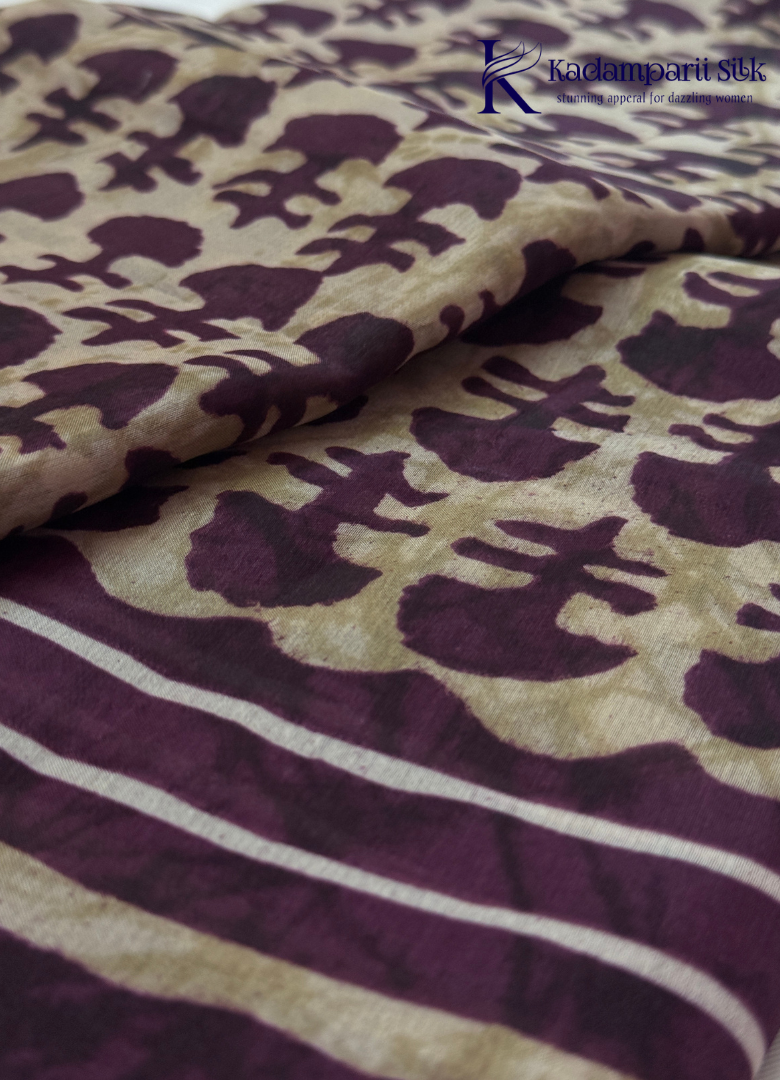 Kadamparii Silk beige semi tussar silk printed saree with wine colour pattern and matching striped border, displayed on a white background.