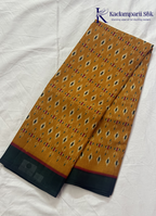 Kadamparii Silk mustard soft semi tussar silk saree with woven pattern and dark contrast border, displayed on a white background.