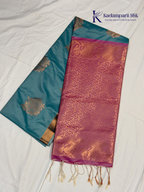 Kadamparii Silk aqua blue semi soft silk saree with magenta zari woven pallu, intricate paisley motifs, floral zari patterns, copper gold border, elegant tassels, and traditional festive design.