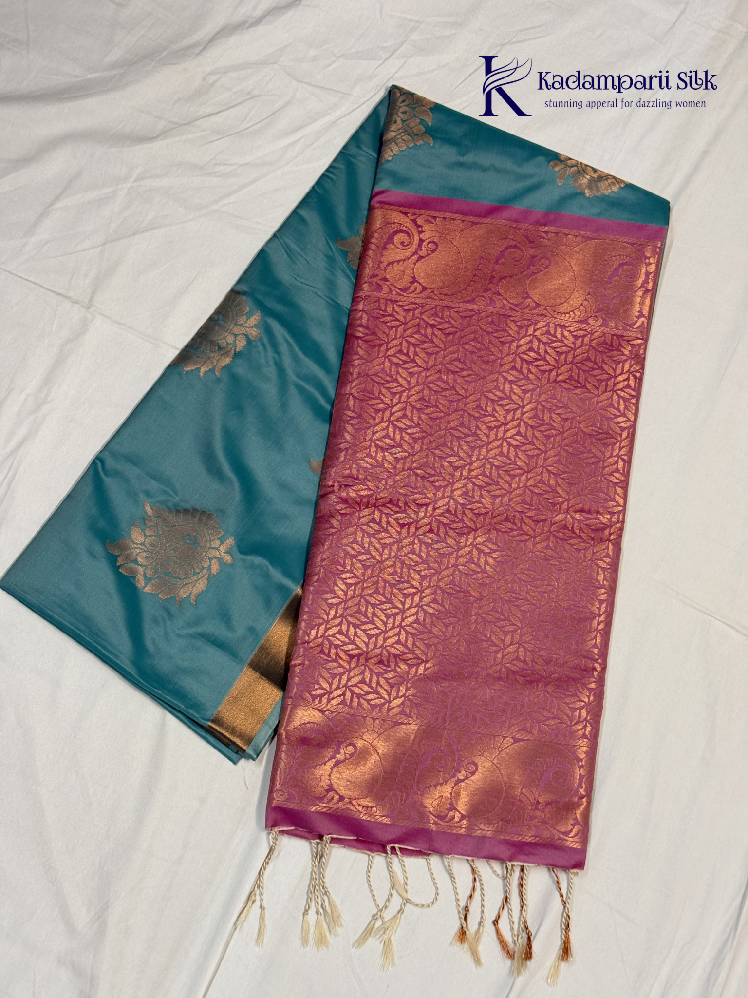 Kadamparii Silk aqua blue semi soft silk saree with magenta zari woven pallu, intricate paisley motifs, floral zari patterns, copper gold border, elegant tassels, and traditional festive design.
