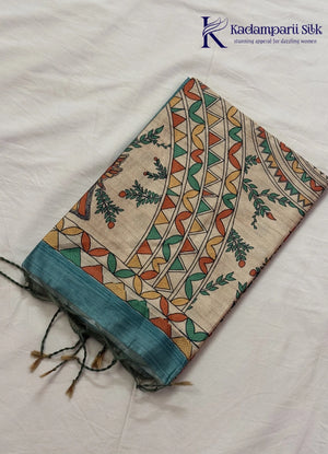 Kadamparii Silk green semi tussar silk saree with floral printed mundhi and multicolour border, displayed on a white background.