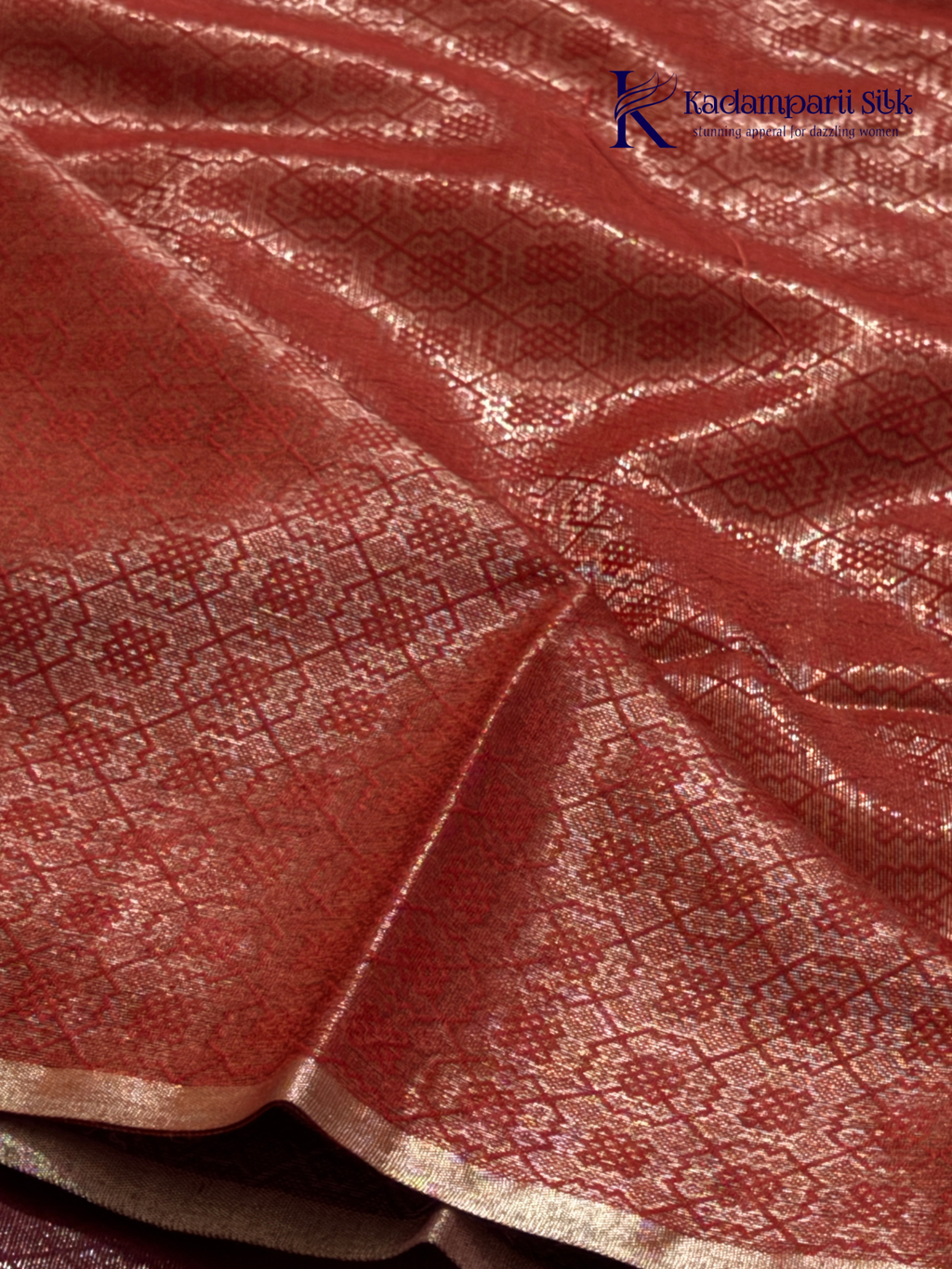Rose pink semi Tussar jacquard saree with all-over woven geometric patterns, subtle silver zari detailing, soft textured finish, elegant tassels, and lightweight traditional drape by Kadamparii Silk.