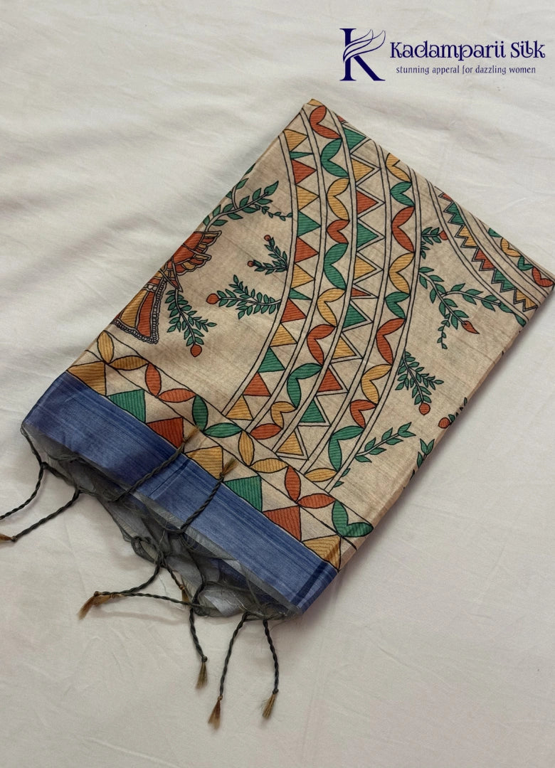 Kadamparii Silk dusty blue semi tussar silk saree with floral printed mundhi and multicolour border, displayed on a white background.