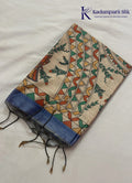 Kadamparii Silk dusty blue semi tussar silk saree with floral printed mundhi and multicolour border, displayed on a white background.