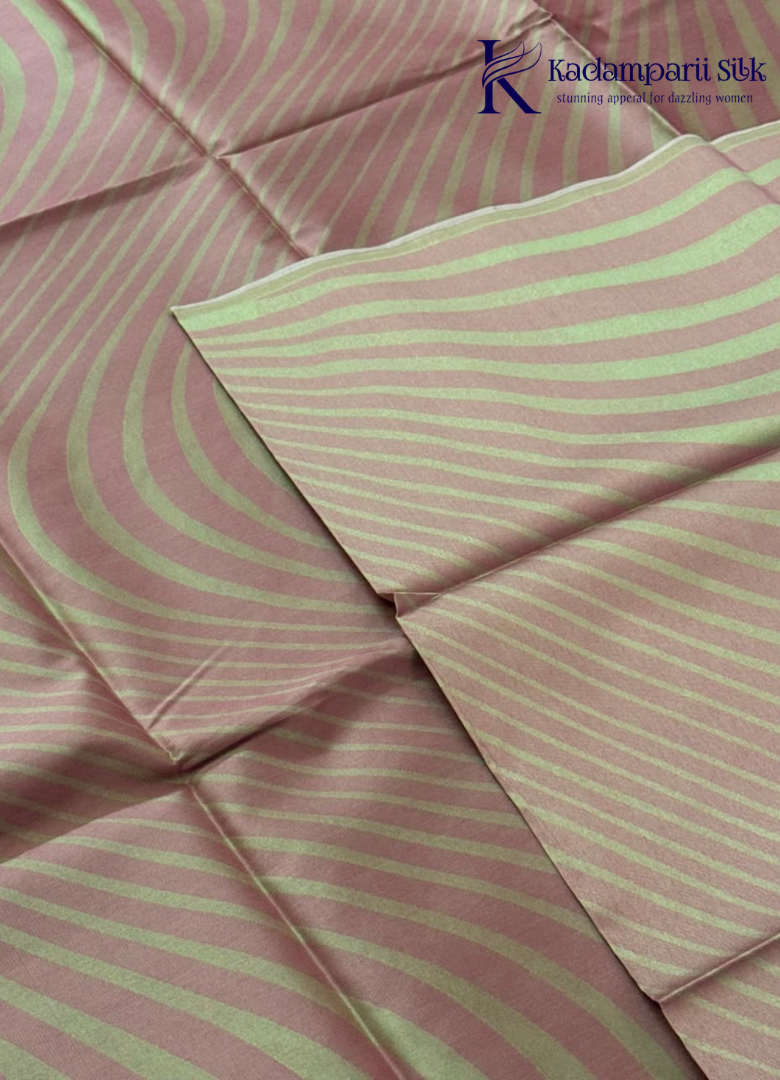 Kadamparii Silk rose pink semi raw silk saree with striped design and contrast border, displayed on a white background.