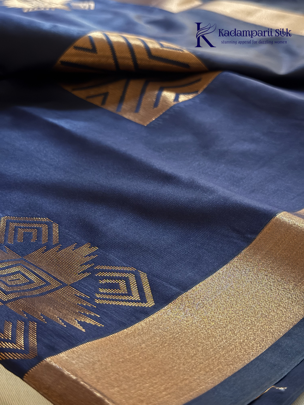 Kadamparii Silk navy blue semi soft silk saree with vibrant magenta zari woven pallu, intricate checkered motifs, copper gold zari border, and elegant tassel detailing.