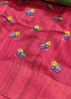 Adorn yourself in this Soft Tussar Silk Saree, featuring a graceful olive green body embellished with delicate floral buttas and finished with a striking rose pink contrast border. Lightweight, elegant, and effortlessly stylish—perfect for every special occasion.