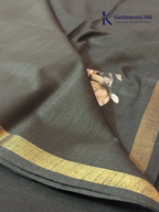 Black semi tussar saree with floral digital print and subtle golden zari border by Kadamparii Silk.