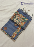 Kadamparii Silk dusty blue semi tussar silk saree with floral printed mundhi and multicolour border, displayed on a white background.