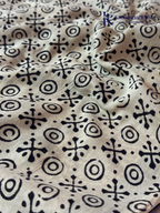 Black Jaipur cotton saree with floral Kalamkari print and traditional printed border by Kadamparii Silk.