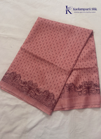 Kadamparii Silk dusty pink raw silk saree with embroidery work, subtle body motifs, and decorative border, displayed on a white background.