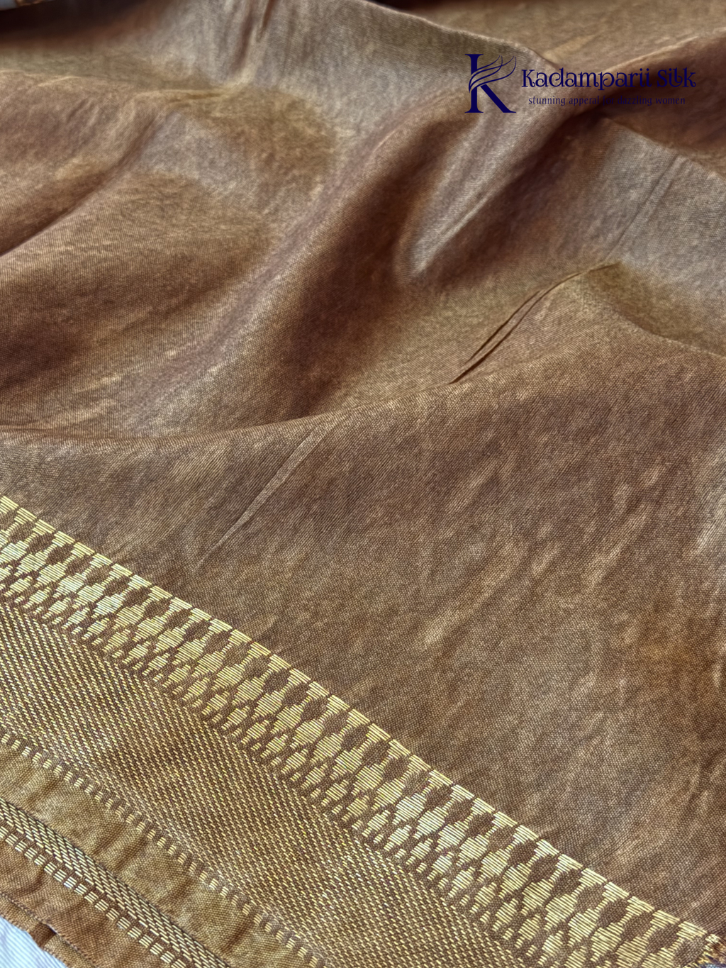 Kadamparii Silk grey semi tussar printed saree with traditional floral and heritage motifs, golden woven border, soft textured fabric, elegant tassels, and sophisticated ethnic design.