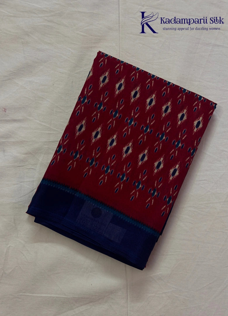 Kadamparii Silk maroon soft semi tussar silk saree with woven pattern and navy blue contrast border, displayed on a white background.