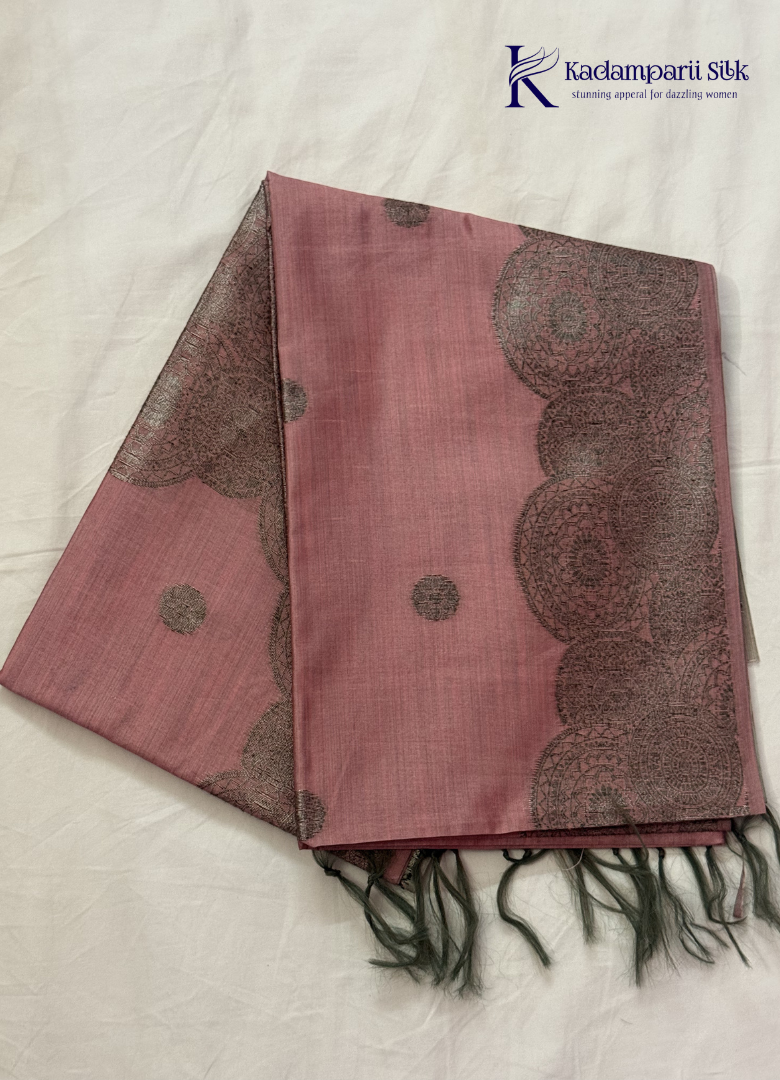 Kadamparii Silk dusty pink raw silk saree with antique zari border and subtle motif detailing, displayed on a white background.