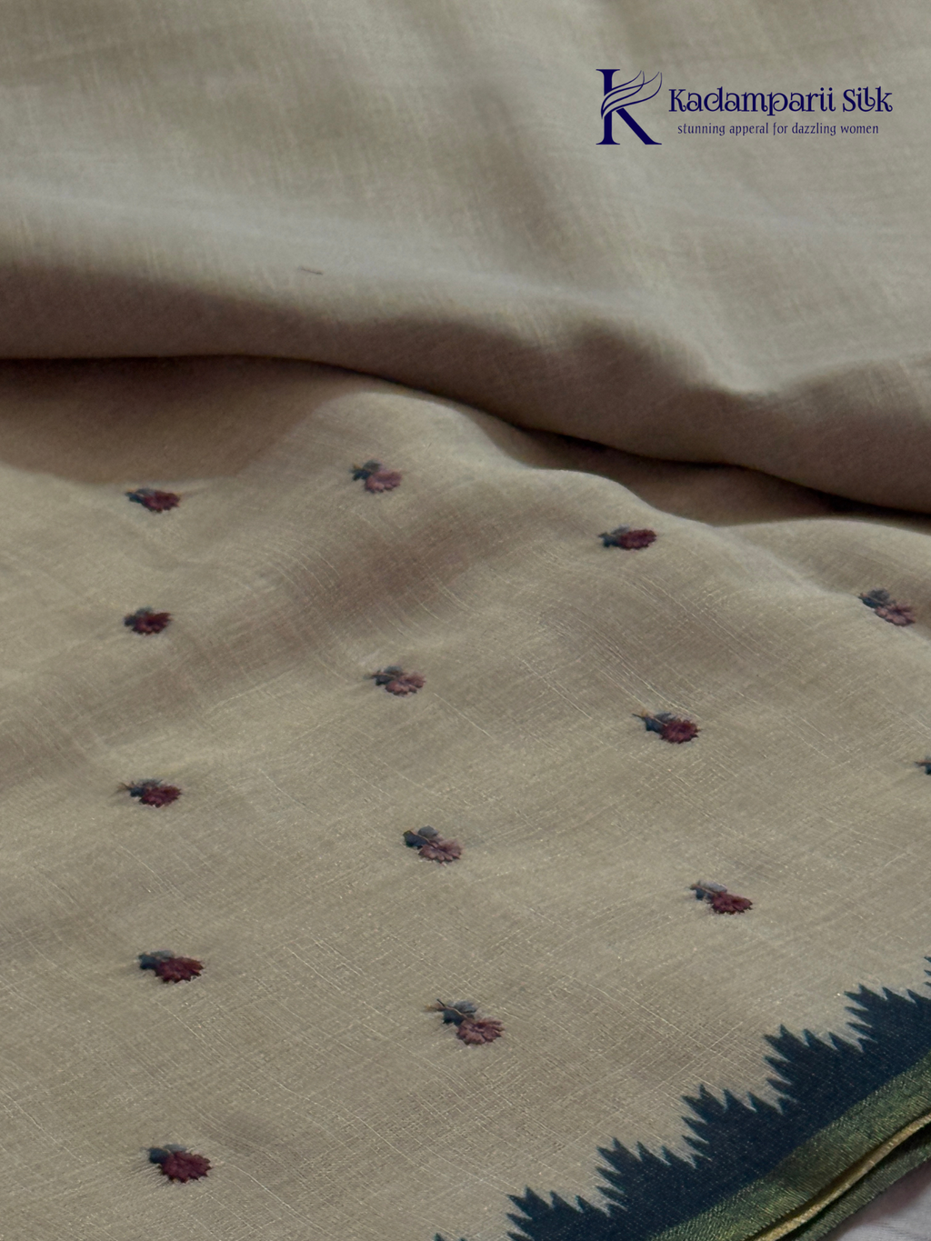 Ivory linen tissue saree with delicate handwork floral embroidery, elegant blue tissue pallu and border, soft lightweight texture, tassel detailing, and graceful ethnic styling by Kadamparii Silk.