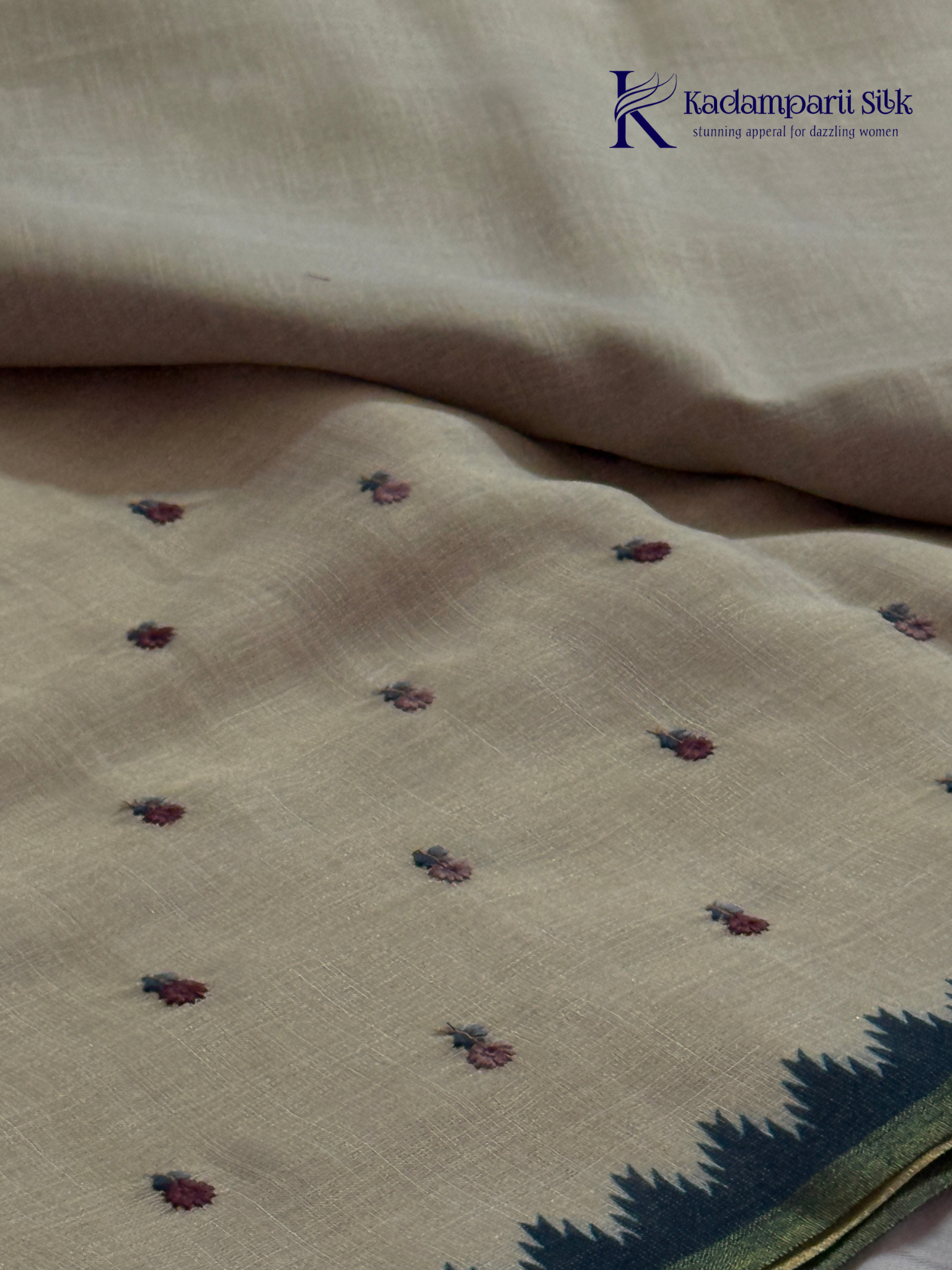 Ivory linen tissue saree with delicate handwork floral embroidery, elegant blue tissue pallu and border, soft lightweight texture, tassel detailing, and graceful ethnic styling by Kadamparii Silk.