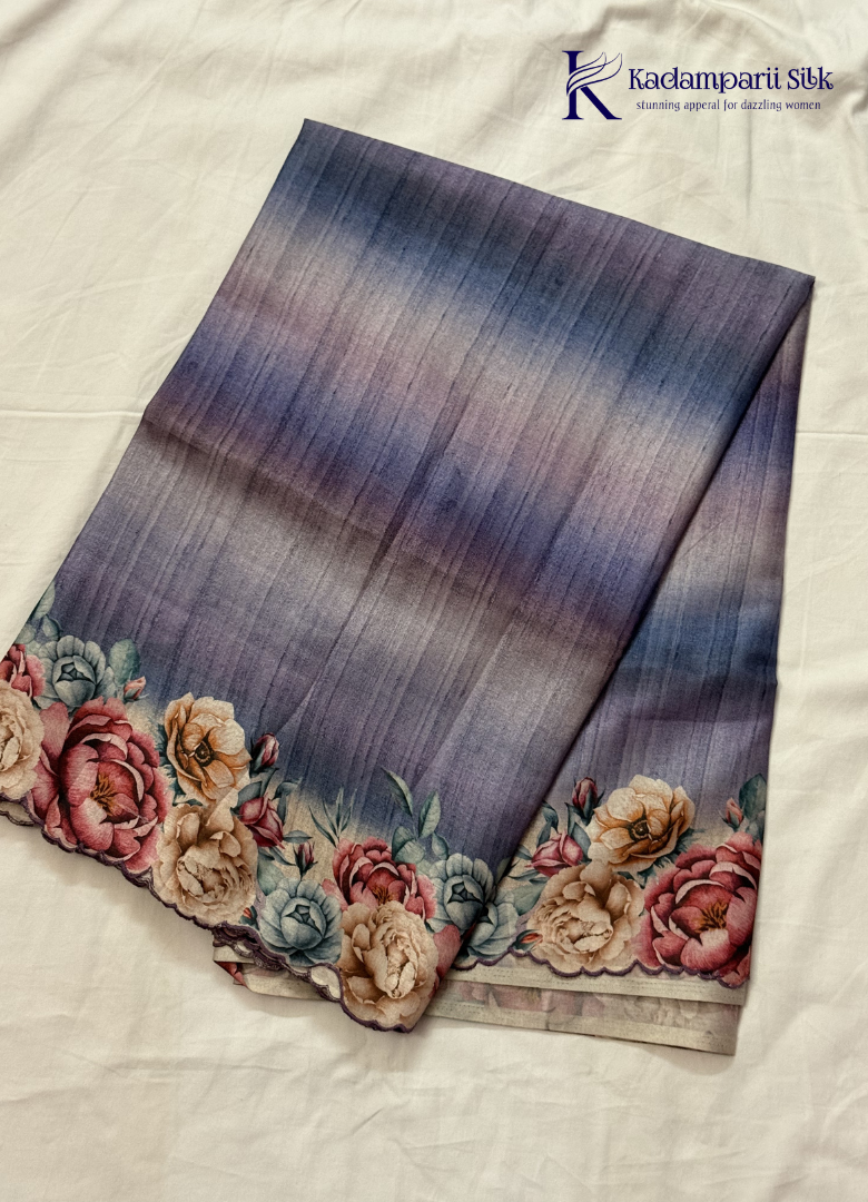 Kadamparii Silk grey tussar saree with digital body and multicolour floral border, displayed on a white background.