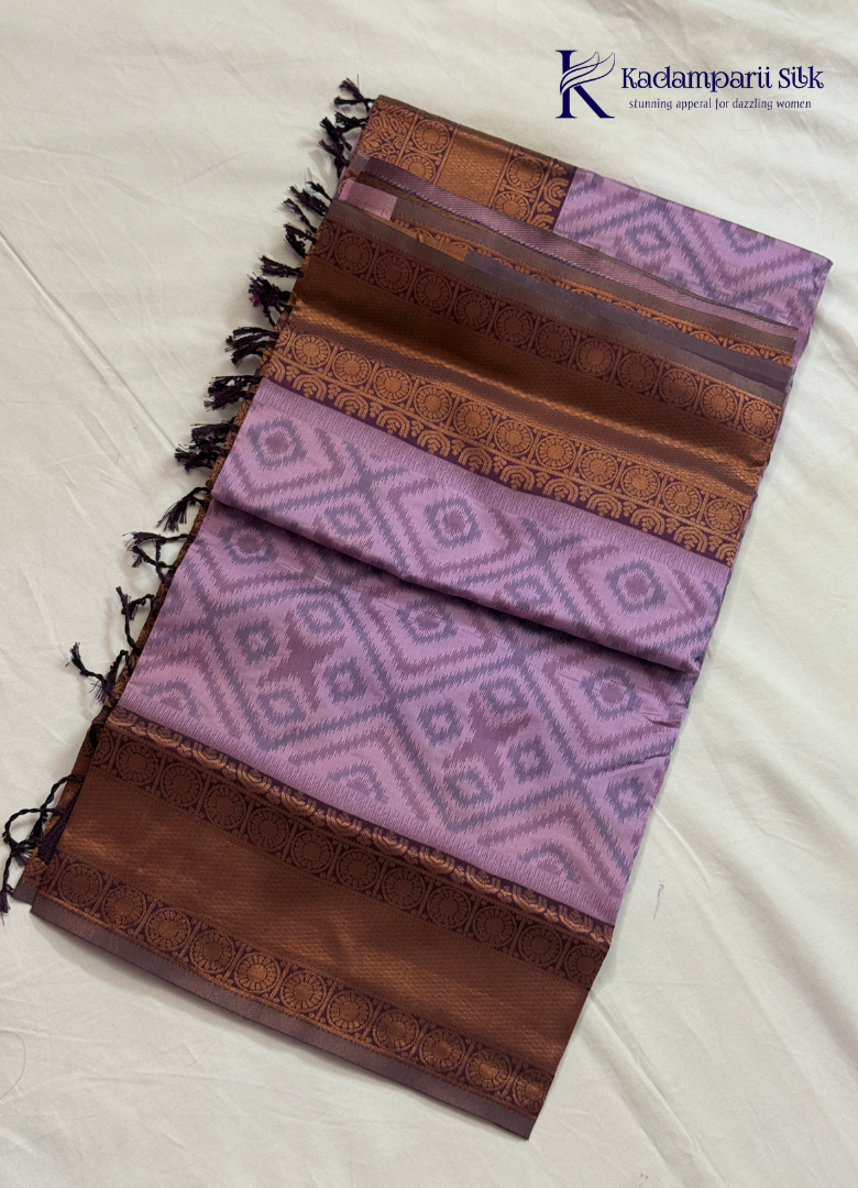 Kadamparii Silk lavender semi silk saree with Pochampally design and rich woven border, displayed on a white background.