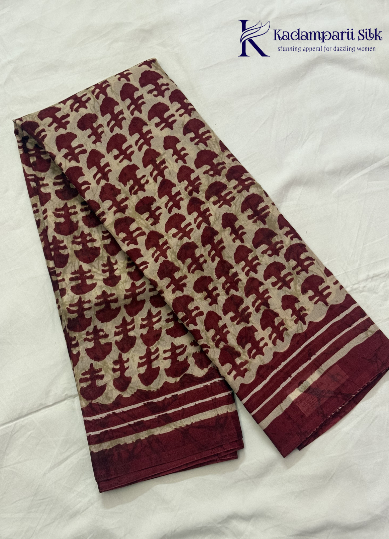 Kadamparii Silk beige semi tussar silk saree with maroon printed pattern and matching striped border, displayed on a white background.