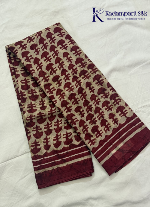 Kadamparii Silk beige semi tussar silk saree with maroon printed pattern and matching striped border, displayed on a white background.