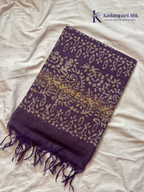 Blush pink semi tussar saree with traditional batik print and purple contrast pallu by Kadamparii Silk.