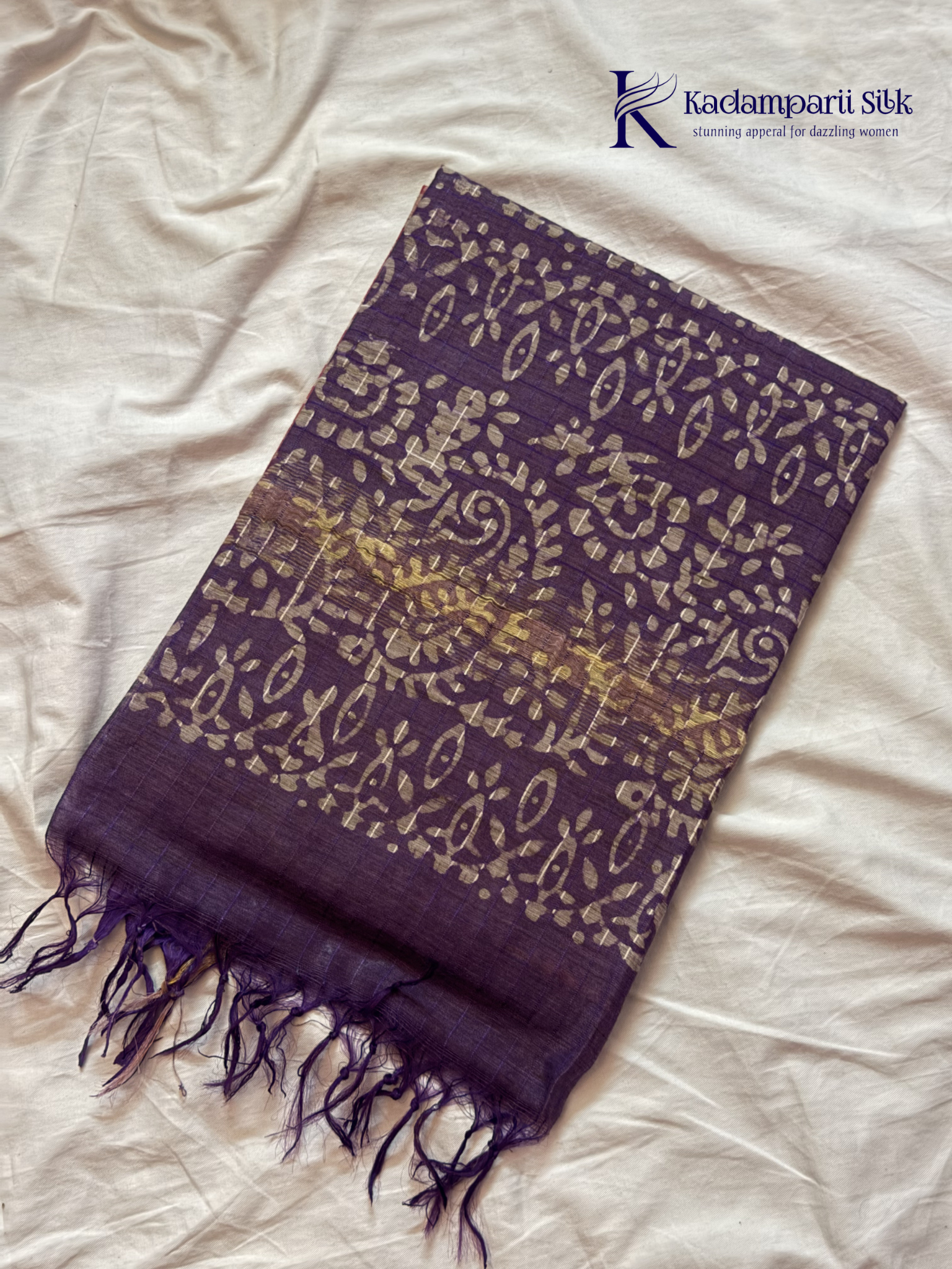 Blush pink semi tussar saree with traditional batik print and purple contrast pallu by Kadamparii Silk.