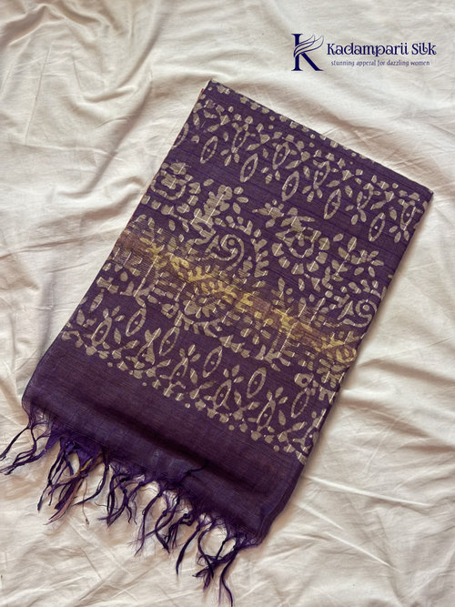 Blush pink semi tussar saree with traditional batik print and purple contrast pallu by Kadamparii Silk.