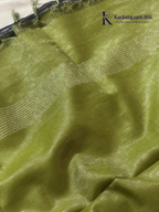 Charcoal grey semi Tussar jacquard saree with intricate woven self-patterns, subtle silver zari border, soft textured finish, elegant tassels, and lightweight graceful drape by Kadamparii Silk.