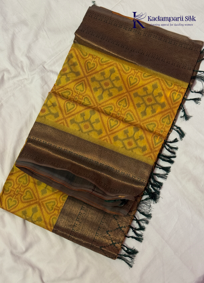 Kadamparii Silk mustard semi soft silk saree with Pochampally design and contrast woven border, displayed on a white background.