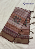 Kadamparii Silk brown soft tussar silk saree with digital print body and traditional motif border, displayed on a white background.