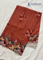 Kadamparii Silk rust orange tussar saree with digital body and multicolour floral border, displayed on a white background.