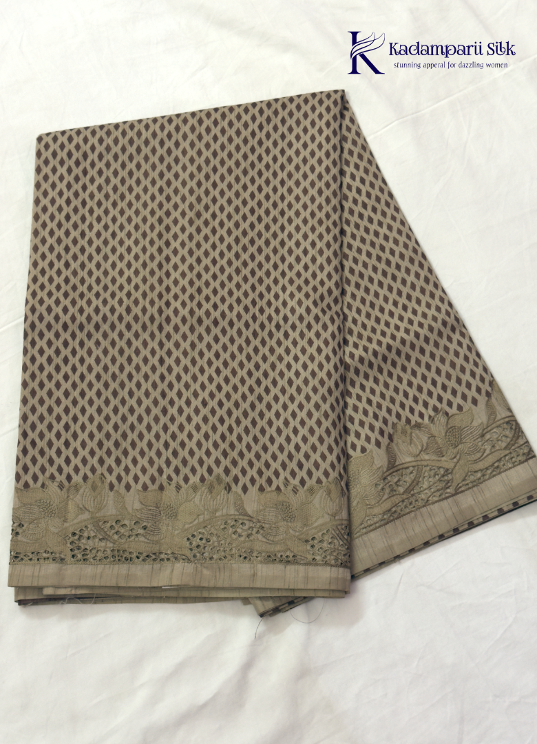 Kadamparii Silk beige tussar silk saree with woven body pattern and detailed cutwork border, displayed on a white background.
