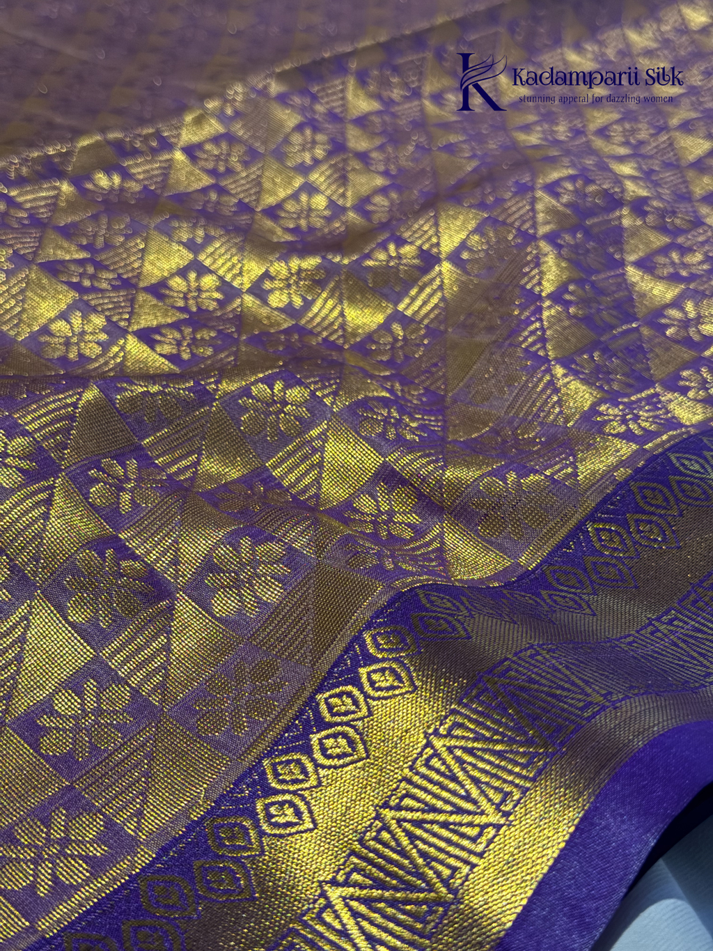 Kadamparii Silk teal blue semi soft silk saree with gold zari motifs, rich purple checkered zari pallu, ornate woven border, royal blue accents, and tassel detailing.