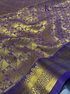 Kadamparii Silk teal blue semi soft silk saree with gold zari motifs, rich purple checkered zari pallu, ornate woven border, royal blue accents, and tassel detailing.