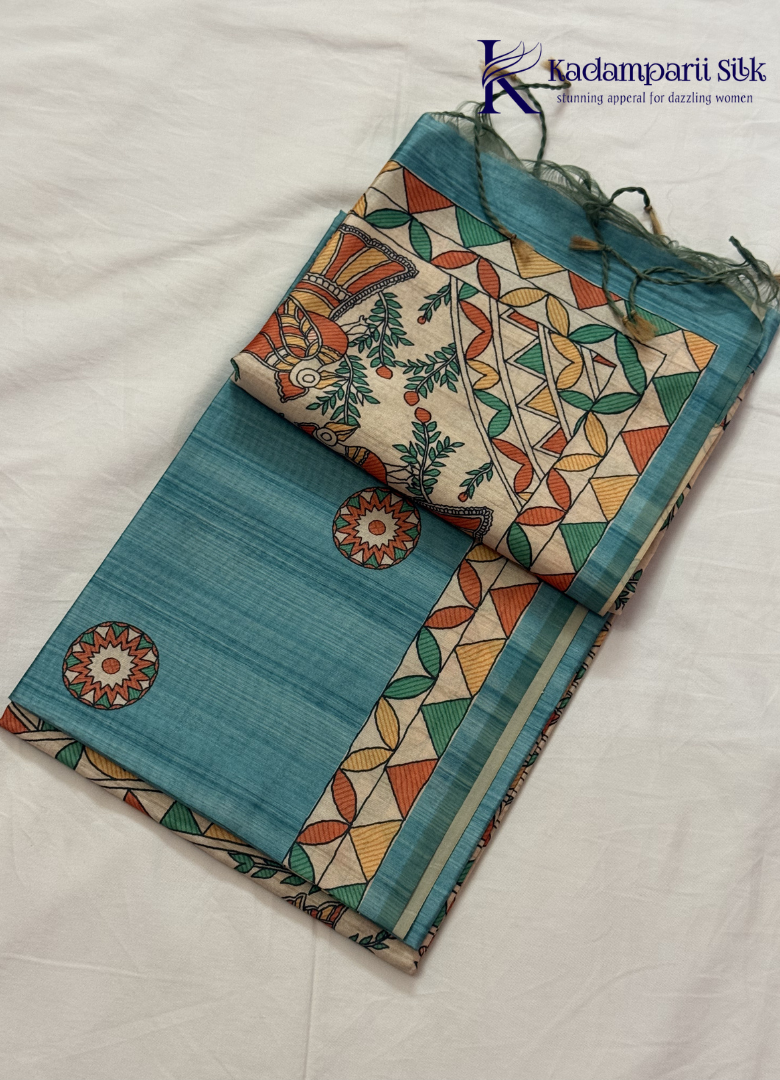 Kadamparii Silk green semi tussar silk saree with floral printed mundhi and multicolour border, displayed on a white background.