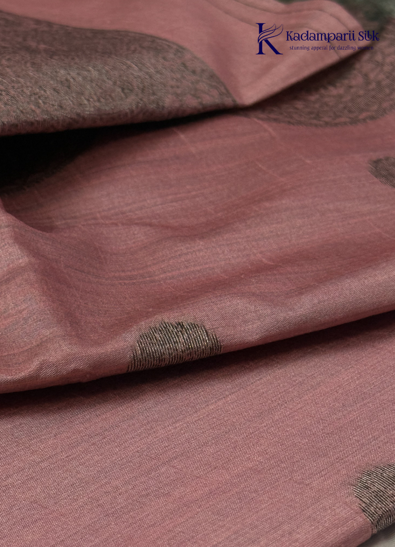 Kadamparii Silk dusty pink raw silk saree with antique zari border and subtle motif detailing, displayed on a white background.